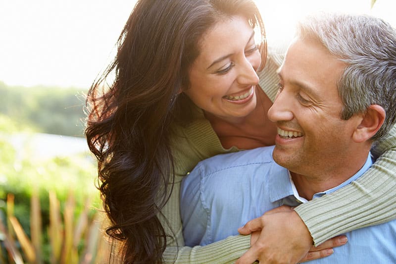 Loving,Hispanic,Couple,In,Countryside