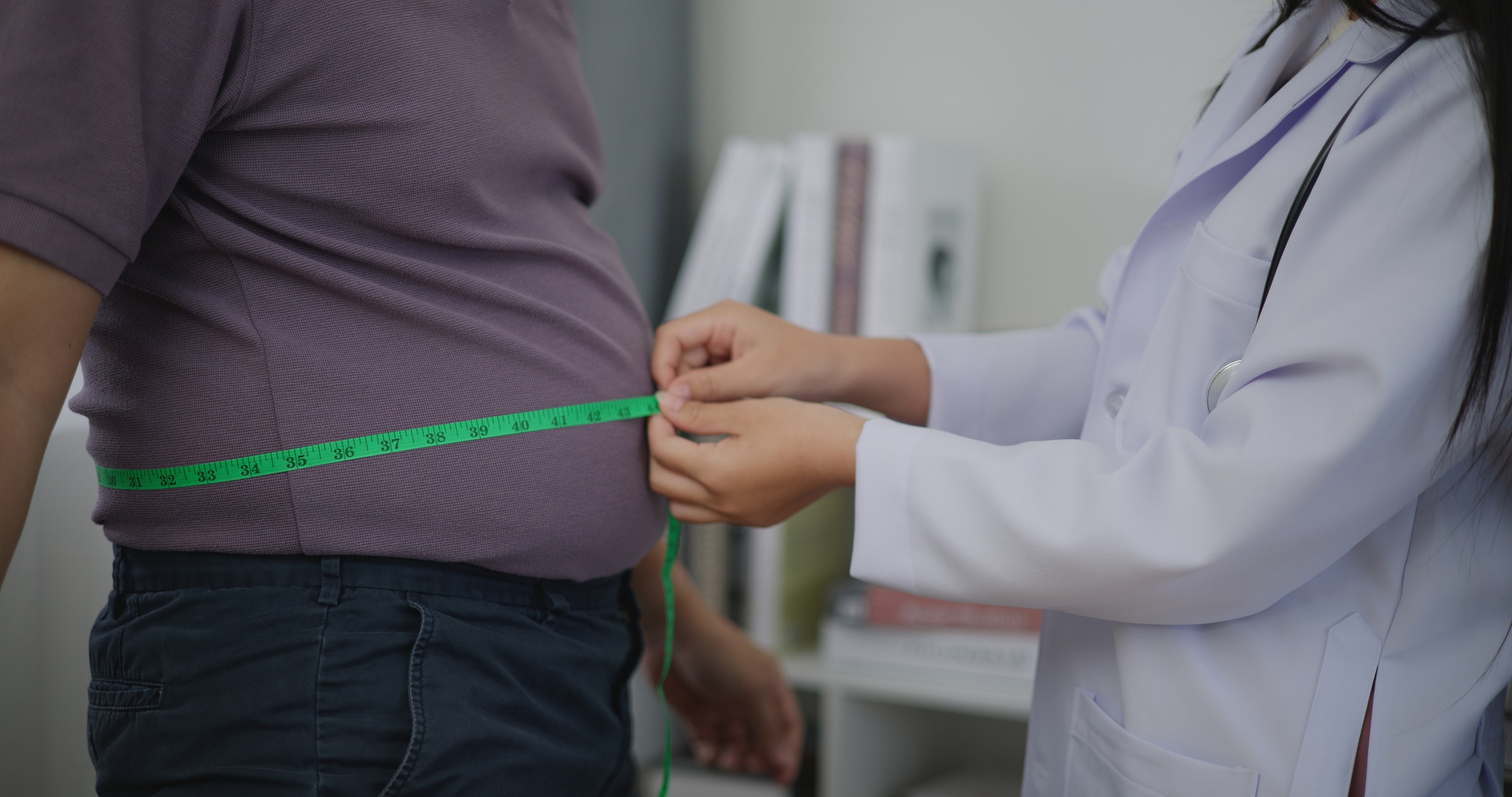 Dietitian assessing a patient during a weight management consultation